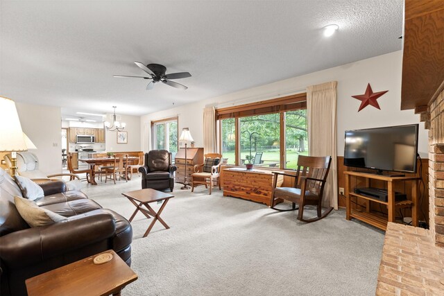 2207 Buchanan Dr, Ames, IA 50010 - living area featuring a ceiling fan, light carpet, and a textured ceiling