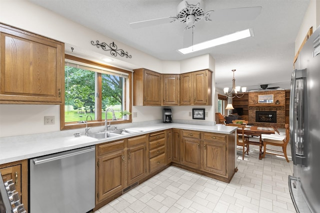 2207 Buchanan Dr, Ames, IA 50010 - kitchen with stainless steel appliances, a ceiling fan, and brown cabinets