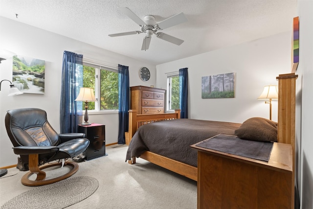 2207 Buchanan Dr, Ames, IA 50010 - bedroom featuring light carpet, a ceiling fan, and a textured ceiling