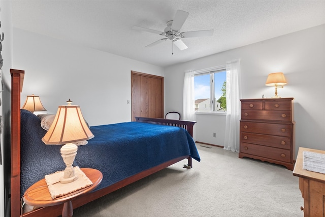 2207 Buchanan Dr, Ames, IA 50010 - bedroom with light colored carpet, ceiling fan, and a closet