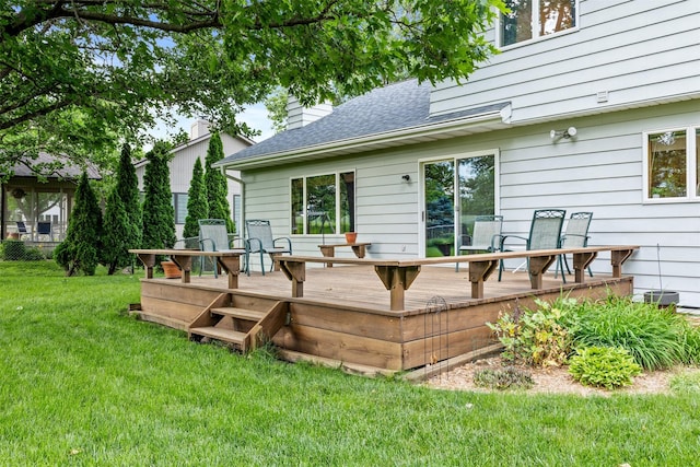 2207 Buchanan Dr, Ames, IA 50010 - back of house with a wooden deck, roof with shingles, a yard, and a chimney