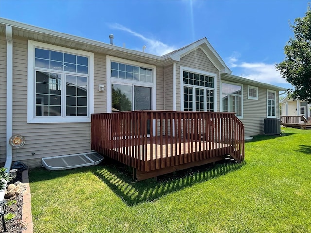 1406 SE Williams Ct, Waukee, IA 50263 - rear view of property featuring a deck and a yard