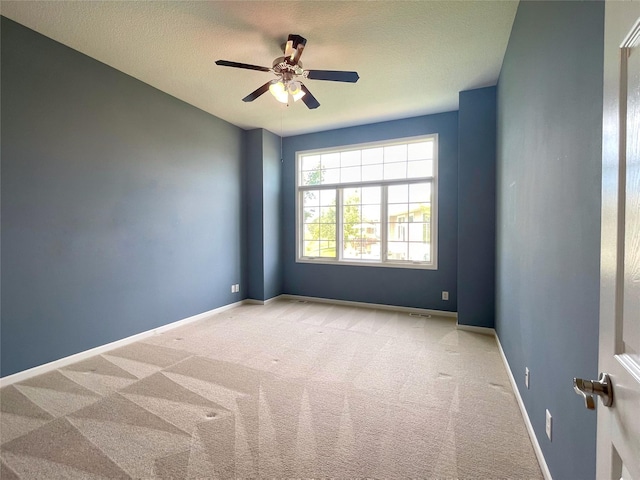 1406 SE Williams Ct, Waukee, IA 50263 - carpeted spare room with a ceiling fan and a textured ceiling