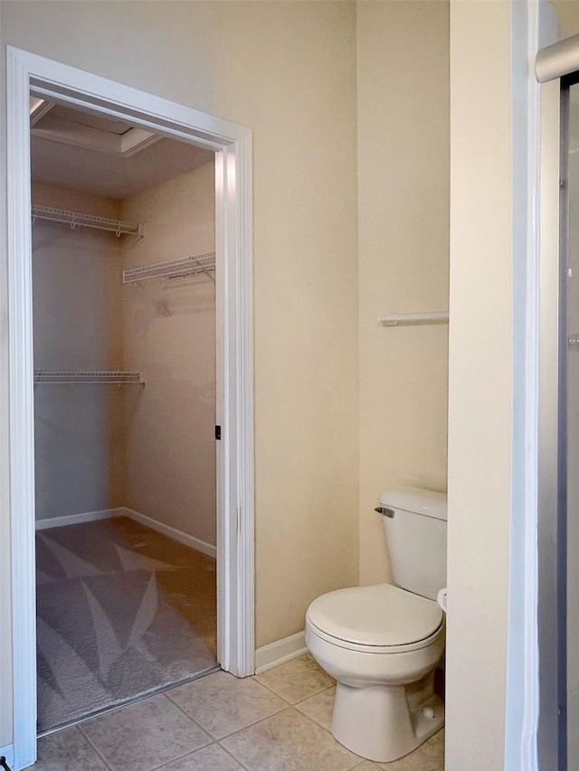 1406 SE Williams Ct, Waukee, IA 50263 - bathroom with a walk in closet and tile patterned flooring