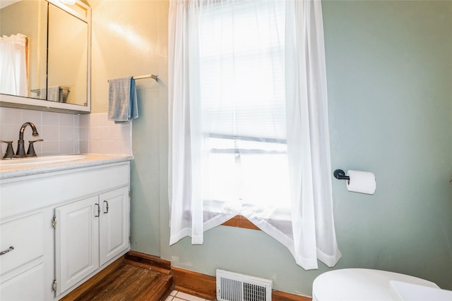 705 Prairie St, Adel, IA 50003 - bathroom featuring tasteful backsplash and vanity