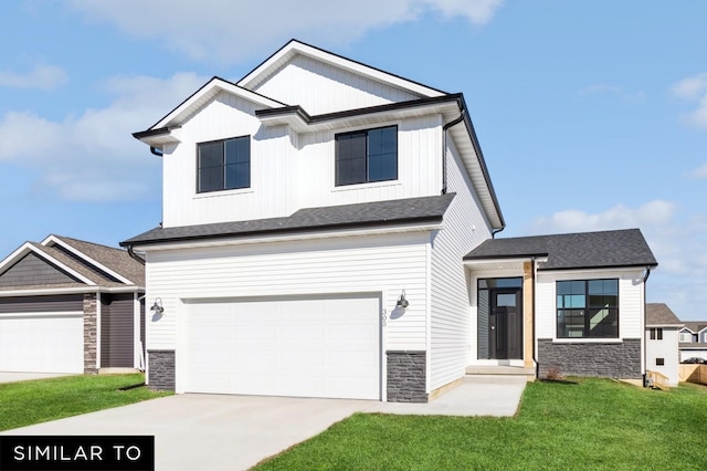 1425 Locust St, Waukee, IA 50263 - view of front of property with stone siding, concrete driveway, a front yard, and a garage