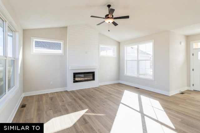 1425 Locust St, Waukee, IA 50263 - unfurnished living room with a fireplace, light wood-style floors, a ceiling fan, and vaulted ceiling