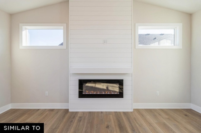 1425 Locust St, Waukee, IA 50263 - detailed view of wood finished floors and a large fireplace