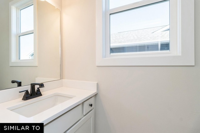 1425 Locust St, Waukee, IA 50263 - bathroom featuring healthy amount of natural light and vanity