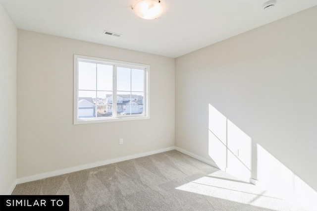1425 Locust St, Waukee, IA 50263 - carpeted spare room featuring a smoke detector and baseboards