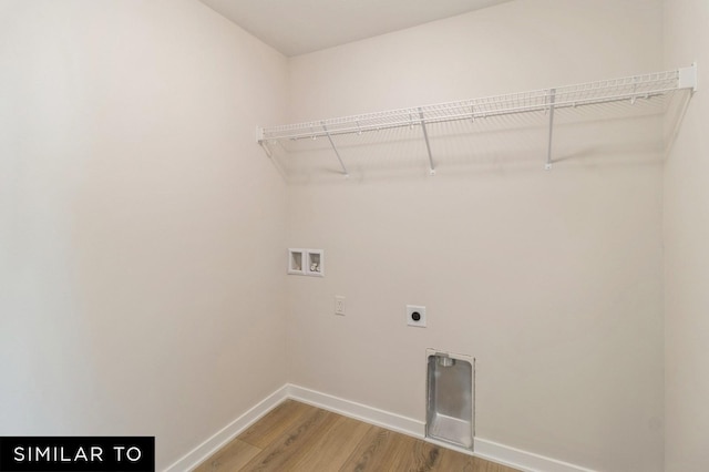 1425 Locust St, Waukee, IA 50263 - washroom with hookup for a washing machine, light wood-style flooring, and hookup for an electric dryer