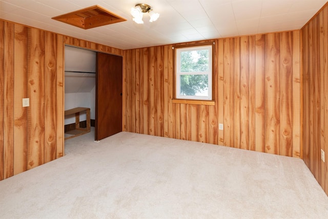 931 Pleasant View Dr, Des Moines, IA 50315 - unfurnished bedroom featuring wooden walls and carpet