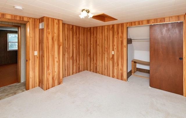 931 Pleasant View Dr, Des Moines, IA 50315 - unfurnished bedroom with carpet floors, wooden walls, and a closet