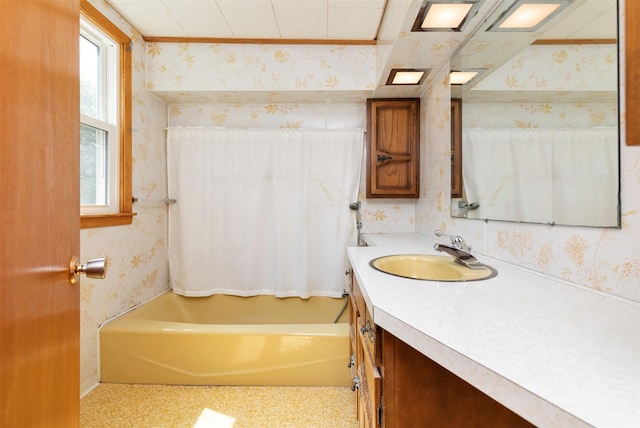 931 Pleasant View Dr, Des Moines, IA 50315 - bathroom featuring wallpapered walls, vanity, and shower / bath combination