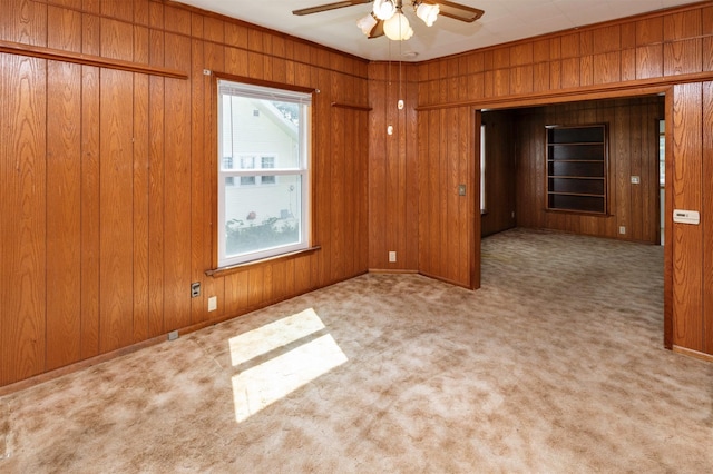 931 Pleasant View Dr, Des Moines, IA 50315 - carpeted empty room featuring wooden walls and ceiling fan