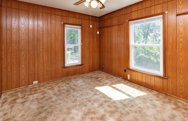 931 Pleasant View Dr, Des Moines, IA 50315 - carpeted empty room with a ceiling fan and wooden walls