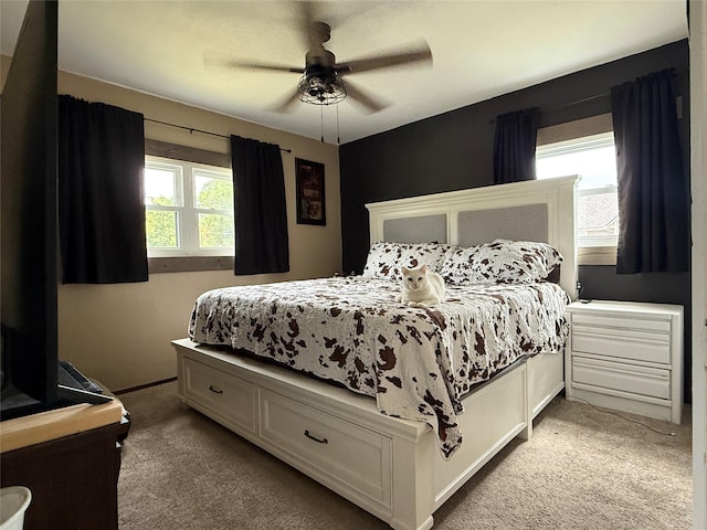205 E Livingston Ave, Des Moines, IA 50315 - carpeted bedroom featuring a ceiling fan