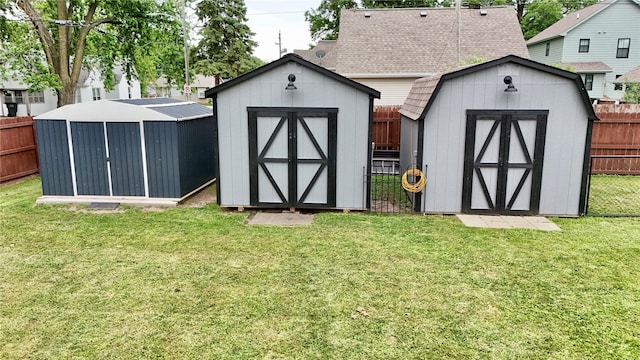 205 E Livingston Ave, Des Moines, IA 50315 - view of shed featuring a fenced backyard