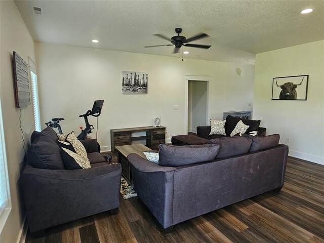 1108 28th St, Perry, IA 50220 - living room with dark wood-style flooring, a ceiling fan, recessed lighting, and a textured ceiling