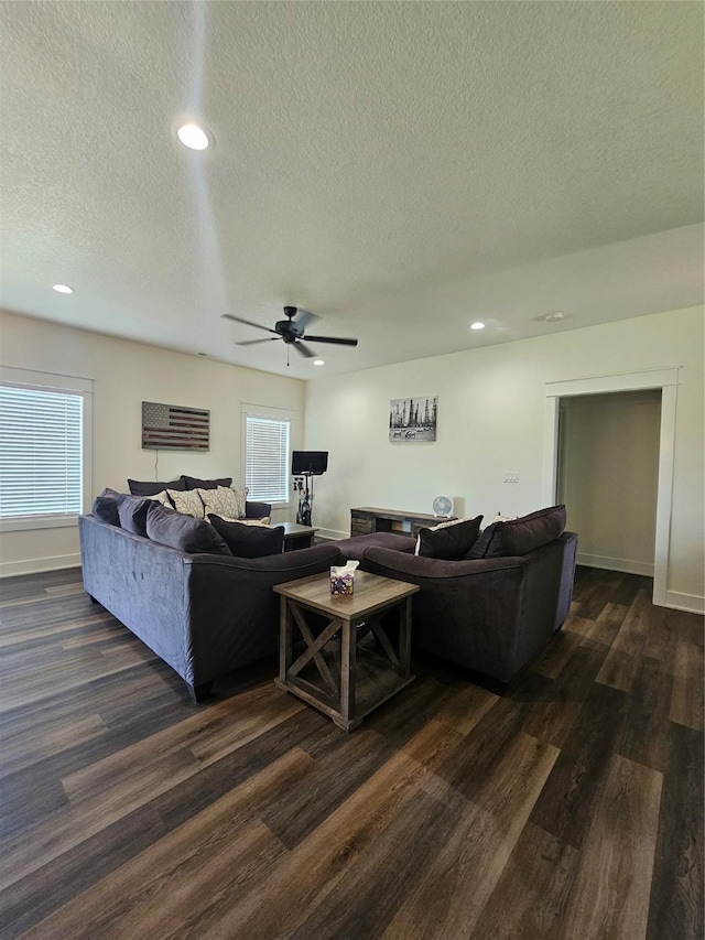 1108 28th St, Perry, IA 50220 - living room featuring dark wood-style flooring, a textured ceiling, ceiling fan, recessed lighting, and healthy amount of natural light