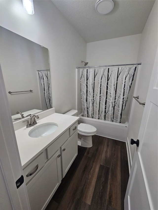 1108 28th St, Perry, IA 50220 - bathroom with vanity, wood finished floors, and shower / tub combo