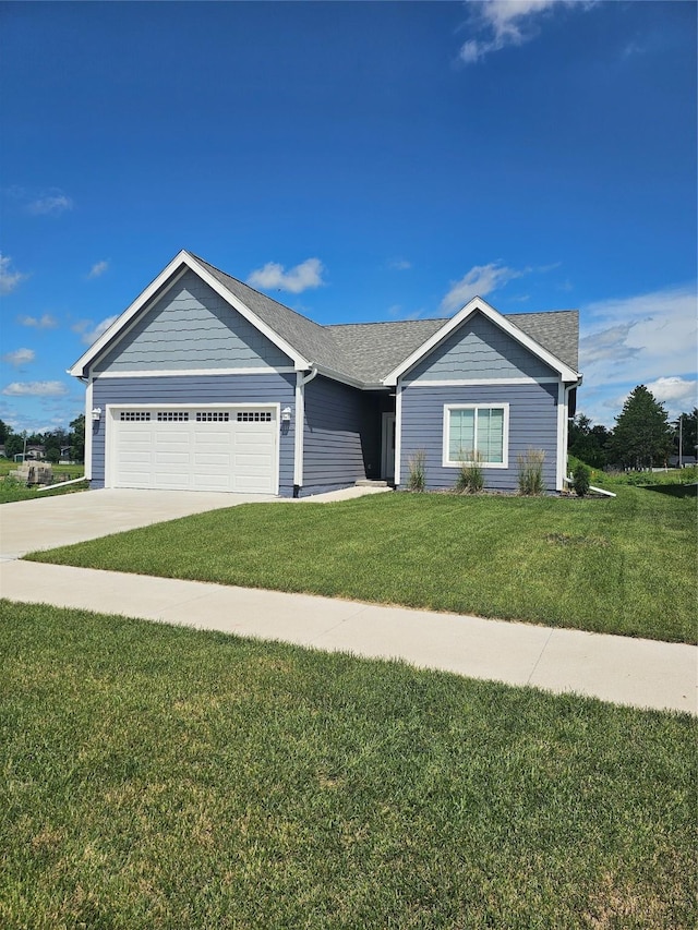 1108 28th St, Perry, IA 50220 - ranch-style house featuring a garage, a front yard, and driveway