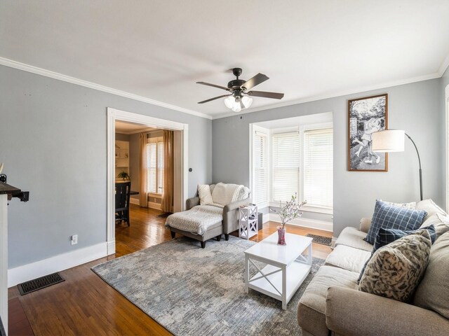 310 Greene St, Boone, IA 50036 - living area with wood finished floors, crown molding, and ceiling fan