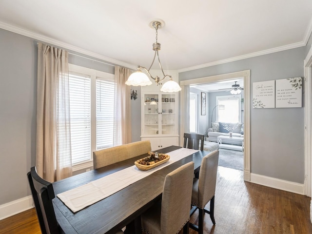 310 Greene St, Boone, IA 50036 - dining area featuring crown molding and dark wood finished floors