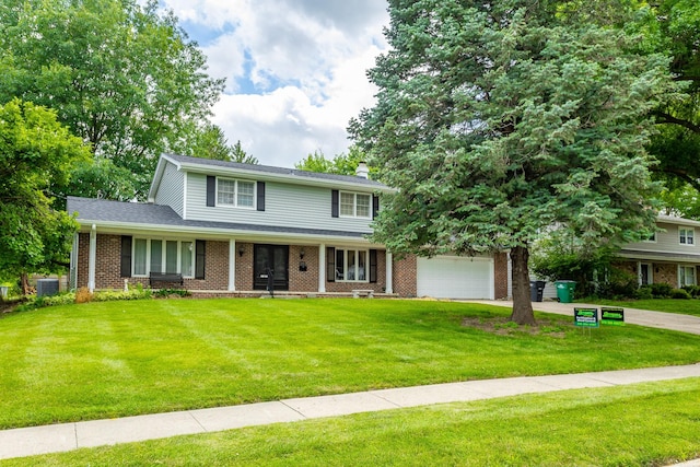 2908 Woodland Ave, West Des Moines, IA 50266 - traditional-style house with a garage, a chimney, brick siding, and a front lawn