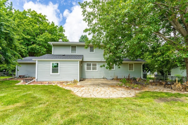2908 Woodland Ave, West Des Moines, IA 50266 - rear view of house with a patio area and a chimney
