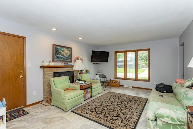 2908 Woodland Ave, West Des Moines, IA 50266 - living room featuring a fireplace and recessed lighting