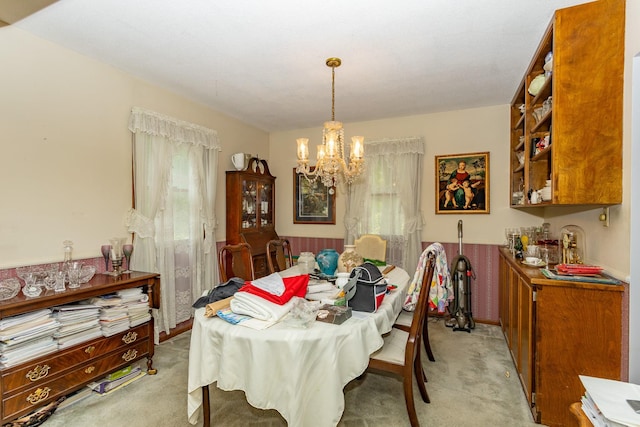 2908 Woodland Ave, West Des Moines, IA 50266 - dining space with light carpet and a chandelier