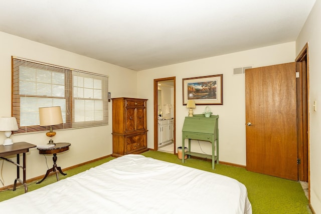 2908 Woodland Ave, West Des Moines, IA 50266 - carpeted bedroom featuring baseboards and connected bathroom