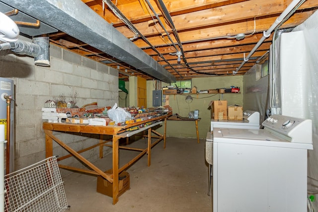 2908 Woodland Ave, West Des Moines, IA 50266 - unfinished below grade area with electric panel, separate washer and dryer, a workshop area, and concrete block wall