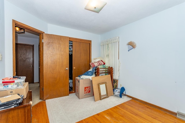 2908 Woodland Ave, West Des Moines, IA 50266 - bedroom with wood finished floors and a closet