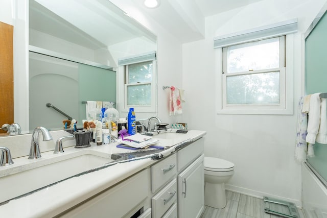 2908 Woodland Ave, West Des Moines, IA 50266 - full bathroom featuring double vanity and toilet