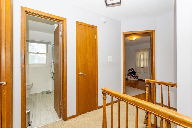 2908 Woodland Ave, West Des Moines, IA 50266 - corridor featuring an upstairs landing and baseboards
