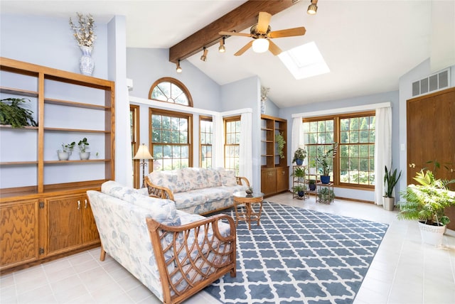 1809 79th St, Windsor Heights, IA 50324 - living area with ceiling fan, a skylight, and light tile patterned floors