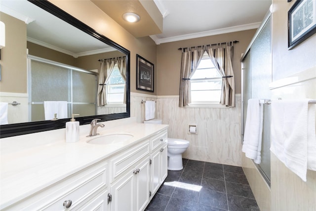 1809 79th St, Windsor Heights, IA 50324 - bathroom with vanity, a stall shower, tile walls, a wainscoted wall, and ornamental molding