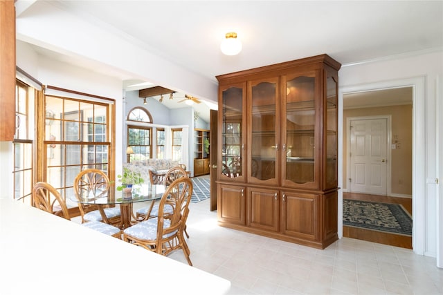 1809 79th St, Windsor Heights, IA 50324 - dining room with ornamental molding, light tile patterned floors, and a ceiling fan
