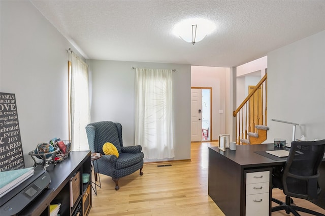 4380 Ashley Park Dr, West Des Moines, IA 50265 - home office featuring light wood-style floors and a textured ceiling