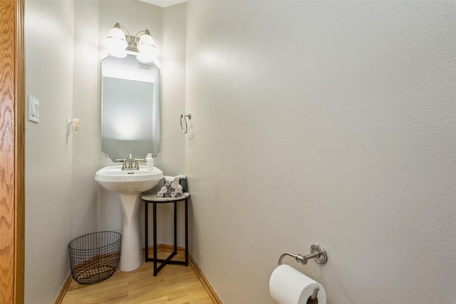 4380 Ashley Park Dr, West Des Moines, IA 50265 - half bath featuring wood finished floors and baseboards