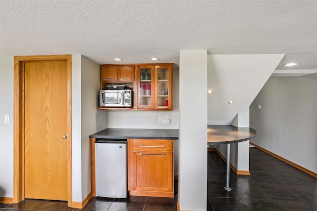 4380 Ashley Park Dr, West Des Moines, IA 50265 - bar area featuring stainless steel microwave, a textured ceiling, and recessed lighting