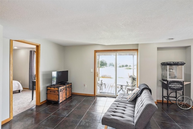 4380 Ashley Park Dr, West Des Moines, IA 50265 - living area with a textured ceiling and tile patterned flooring