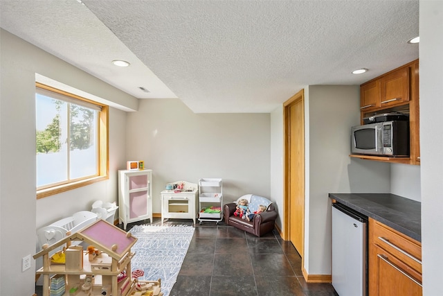 4380 Ashley Park Dr, West Des Moines, IA 50265 - recreation room with a textured ceiling and recessed lighting