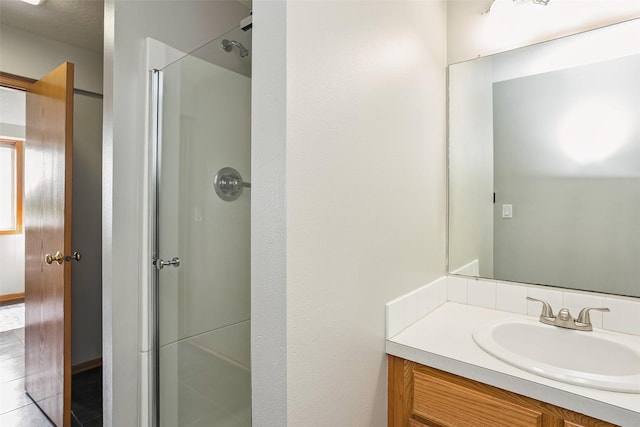 4380 Ashley Park Dr, West Des Moines, IA 50265 - bathroom featuring vanity, a stall shower, and tile patterned flooring