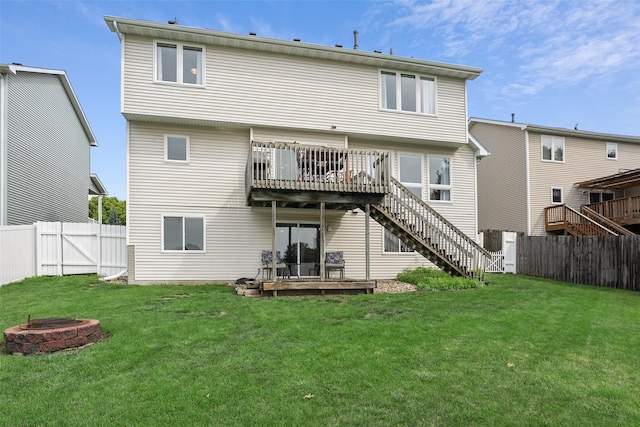 4380 Ashley Park Dr, West Des Moines, IA 50265 - rear view of house featuring an outdoor fire pit, a wooden deck, stairway, and a fenced backyard
