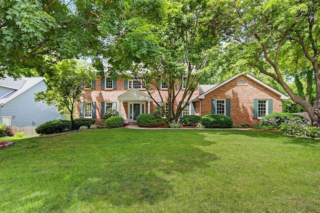 904 54th St, West Des Moines, IA 50266 - view of front of property featuring brick siding and a front lawn