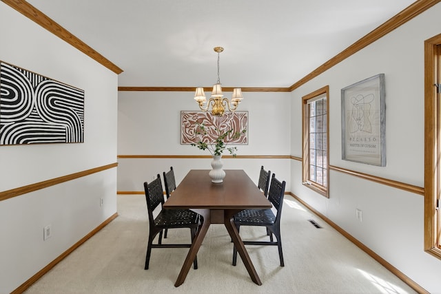 904 54th St, West Des Moines, IA 50266 - carpeted dining space featuring a chandelier and crown molding