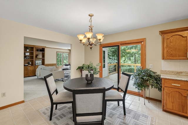 904 54th St, West Des Moines, IA 50266 - dining space with a chandelier and light tile patterned floors